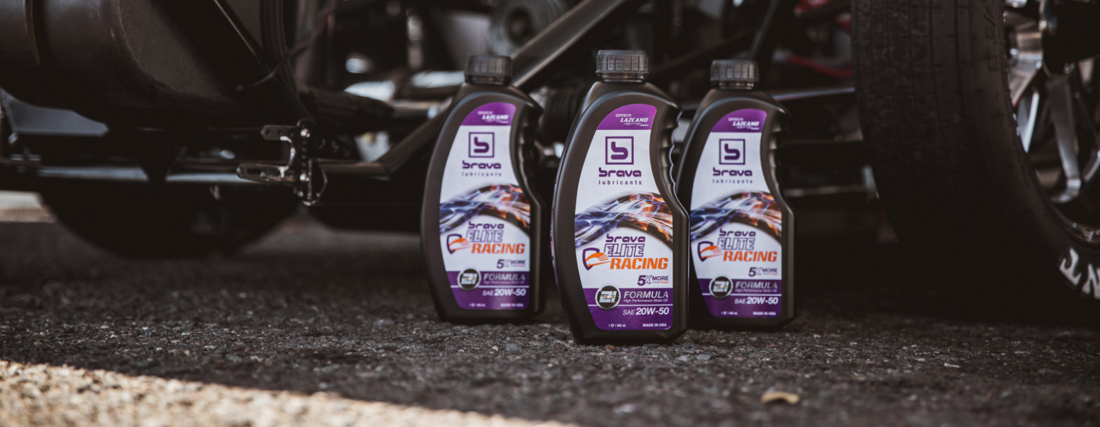 elite racing oil product bottles