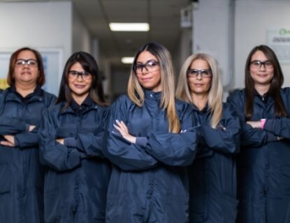 5 female lab technicians in lab coats